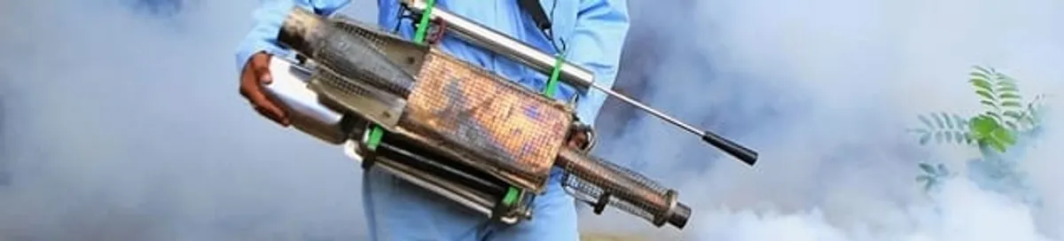 Fumigation technician using a fogger for deep pest treatment in San Antonio, TX